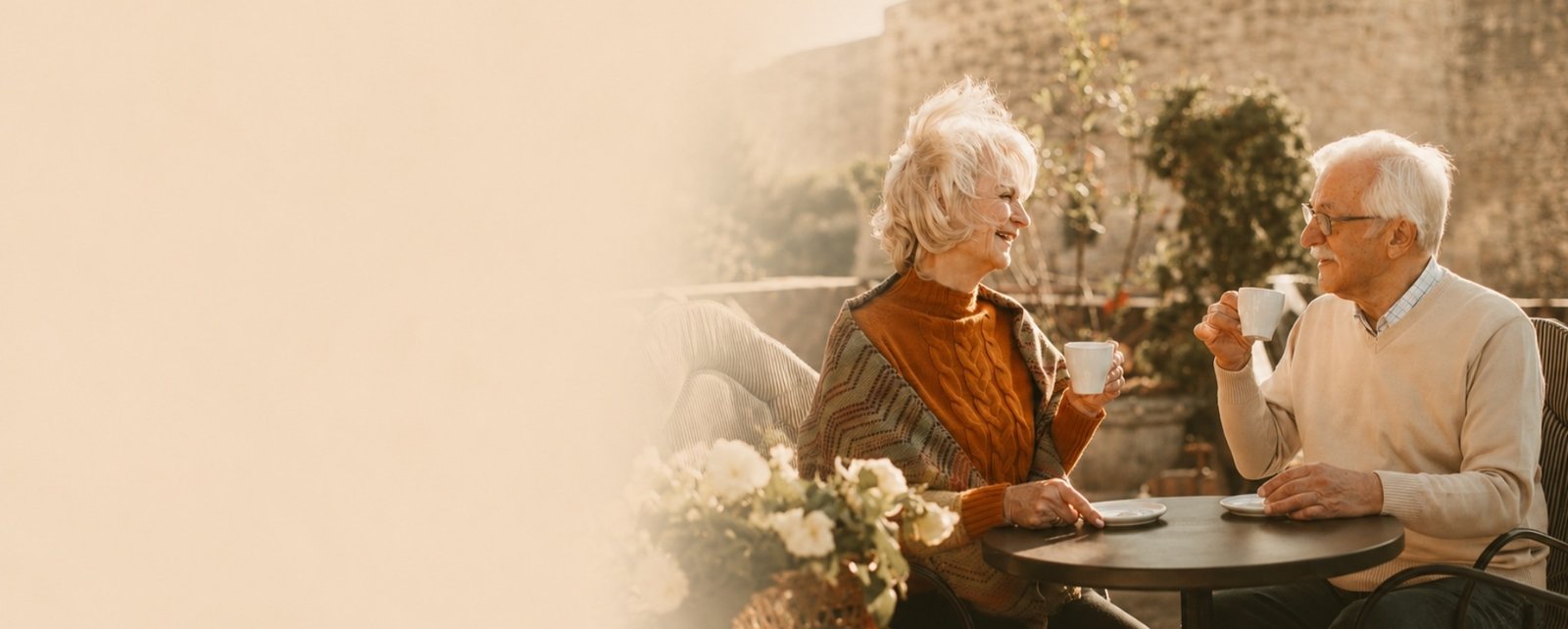 A senior couple enjoying coffee together outdoors