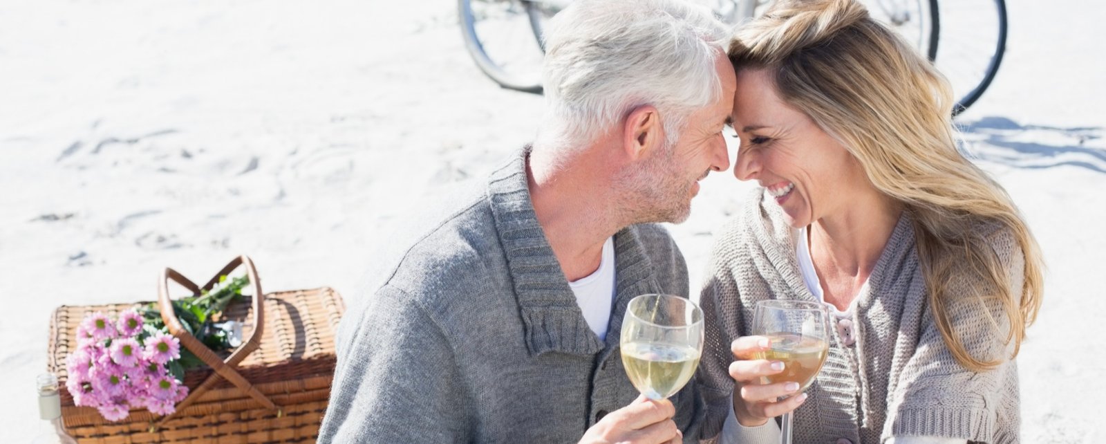 A mature couple enjoying a relaxed picnic together