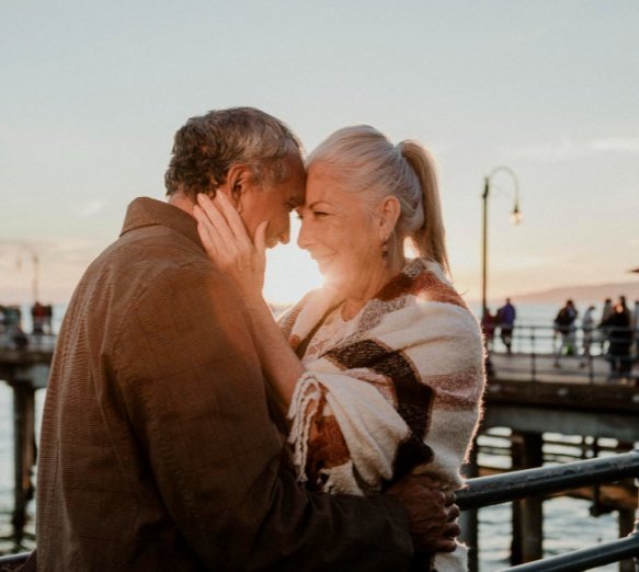 A mature couple connecting by the water